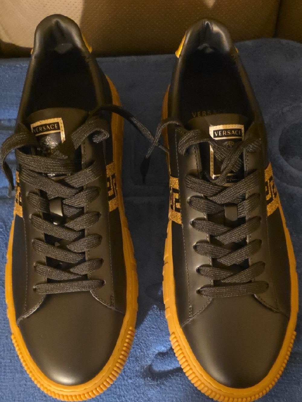 Versace Black Leather Sneakers with Gold Trim and Gum Soles